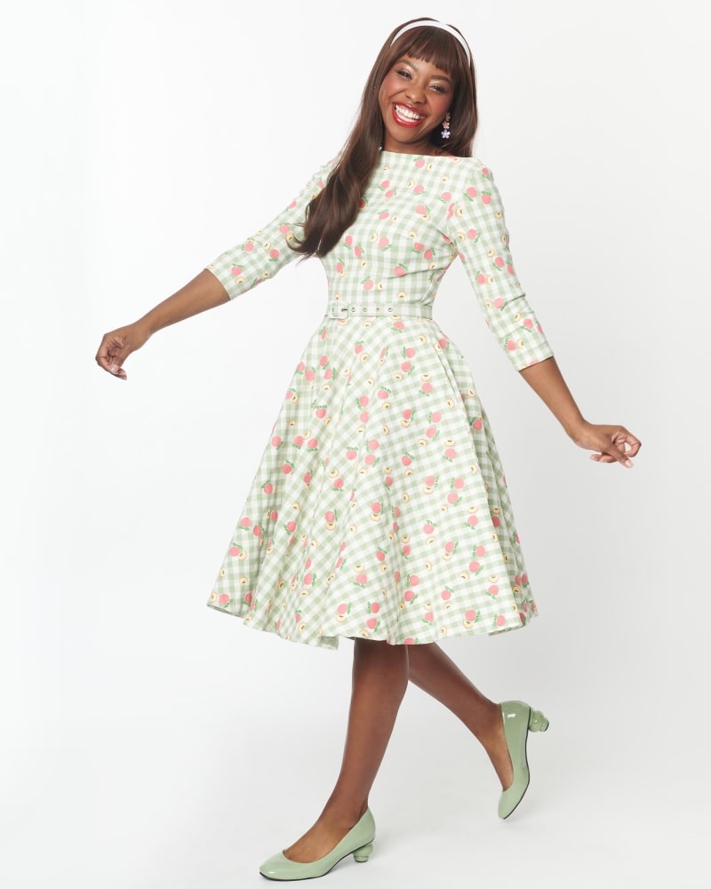 Front of a model wearing a size 3X Unique Vintage Green & Peach Gingham Devon Swing Dress in Green, White, Gingham by Unique Vintage. | dia_product_style_image_id:300863